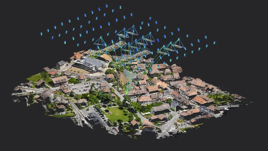 Modèle 3D d’un village reconstitué à partir de photos drone, avec les positions de prise de vue
